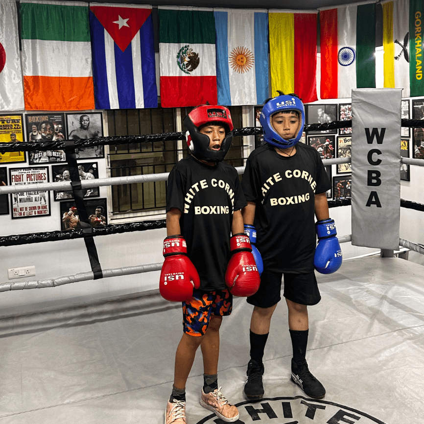 Young boxers at White Corner Boxing Academy in Bangalore ready for sparring in a safe and controlled environment.