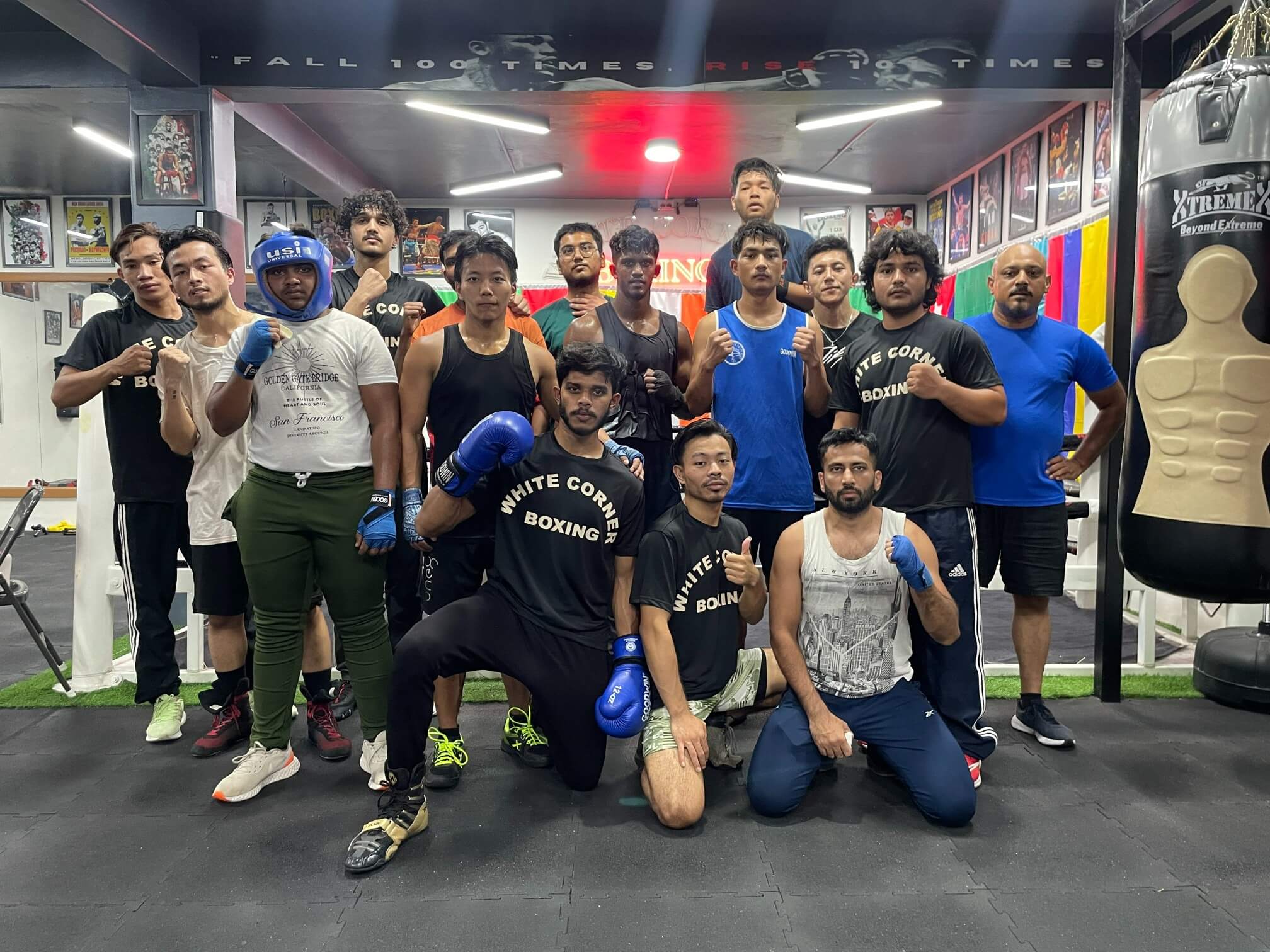 Group of boxers and coaches posing after training session at White Corner Boxing classes in Bangalore