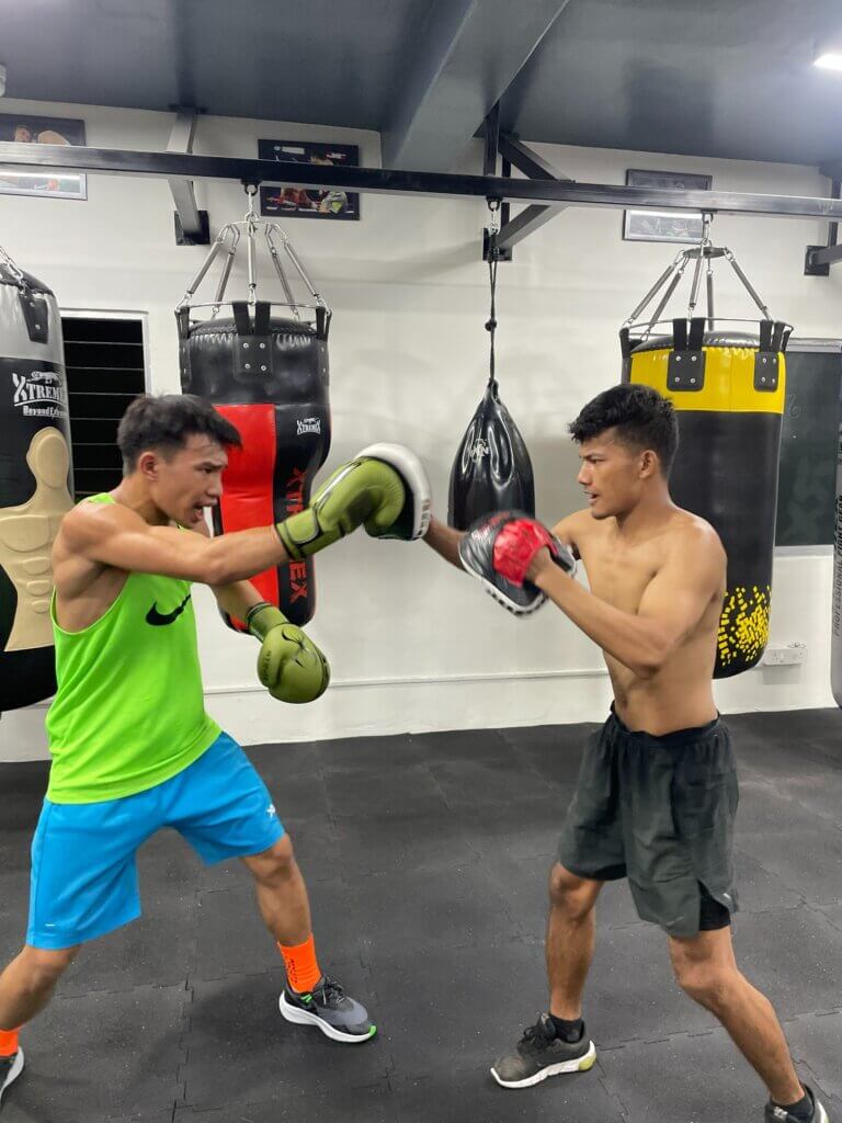 Boxing mitt drills at White Corner Boxing Academy, part of strength and conditioning training in Bangalore for beginners and pros